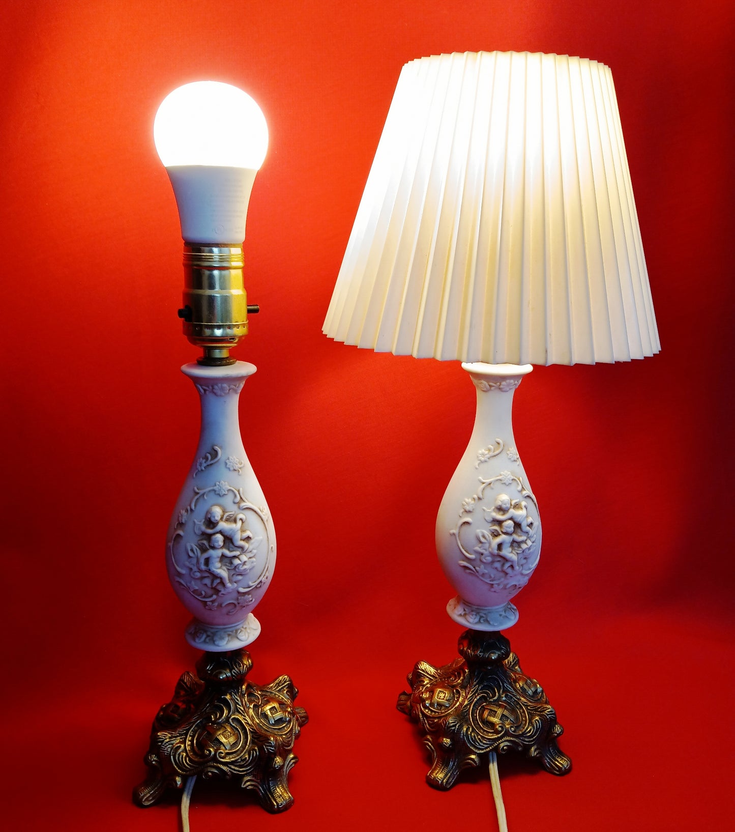Pair Bisque Porcelain Mid Century Accent Table Lamps Off White w/ Embossed Cherubs/Angels Gold Cast Brass Footed Base Rococo Style Retro