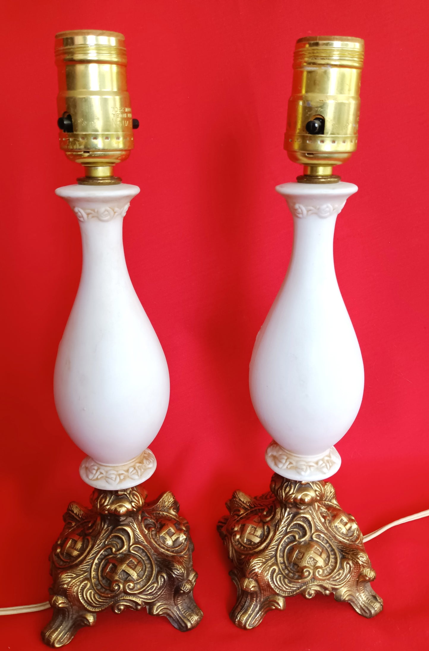 Pair Bisque Porcelain Mid Century Accent Table Lamps Off White w/ Embossed Cherubs/Angels Gold Cast Brass Footed Base Rococo Style Retro