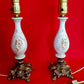 Pair Bisque Porcelain Mid Century Accent Table Lamps Off White w/ Embossed Cherubs/Angels Gold Cast Brass Footed Base Rococo Style Retro