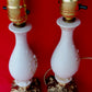 Pair Bisque Porcelain Mid Century Accent Table Lamps Off White w/ Embossed Cherubs/Angels Gold Cast Brass Footed Base Rococo Style Retro
