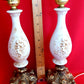 Pair Bisque Porcelain Mid Century Accent Table Lamps Off White w/ Embossed Cherubs/Angels Gold Cast Brass Footed Base Rococo Style Retro